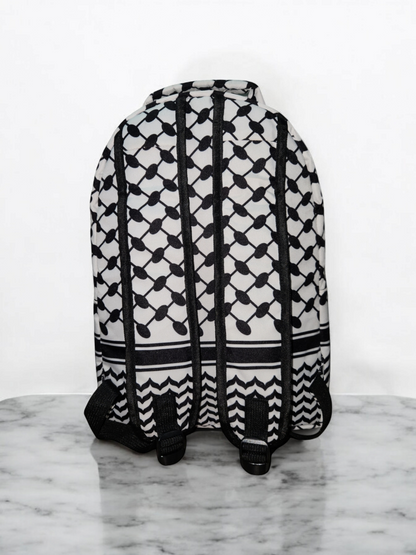 Back view of Palestinia FC Keffiyeh Backpack showing kufiya pattern and adjustable black straps on marble background