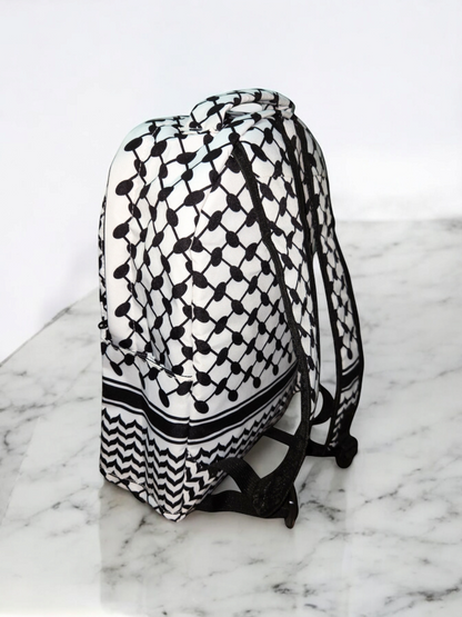 Side view of Palestinia FC Keffiyeh Backpack showing black and white kufiya pattern and adjustable padded straps