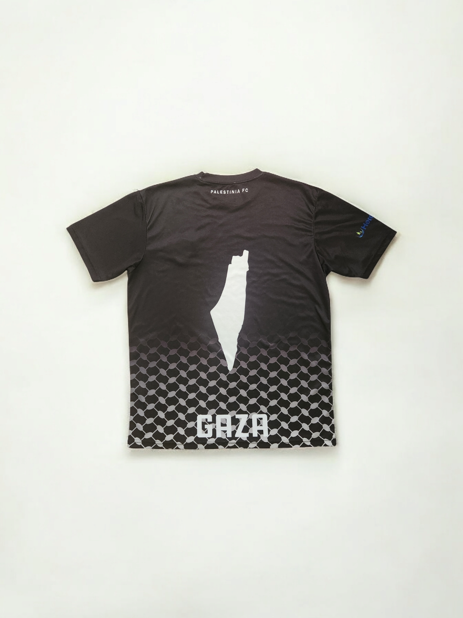 Back view of Kids Black Palestine jersey showing Gaza silhouette and Palestinia FC text across keffiyeh pattern
