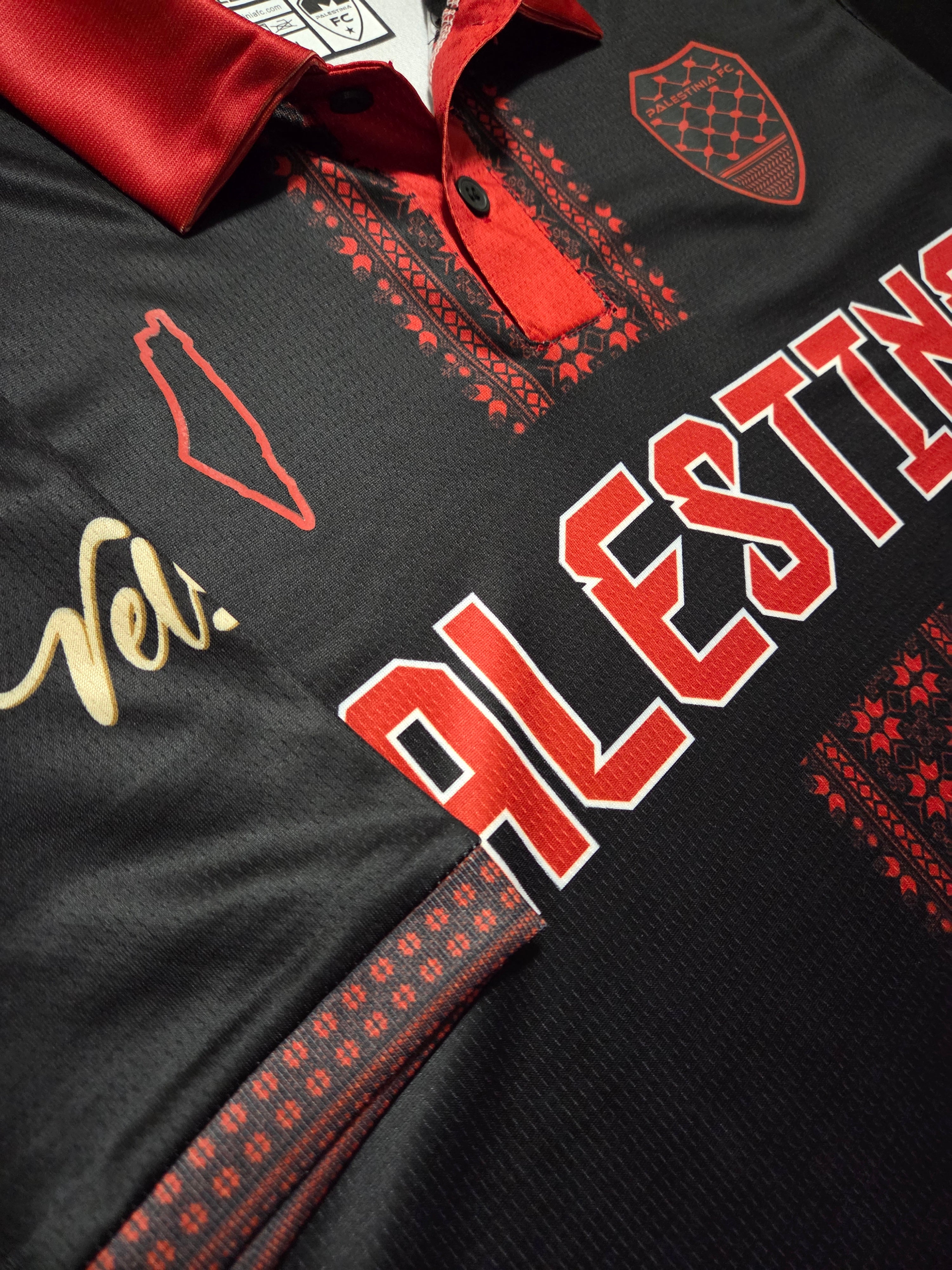 Close-up of Tatreez embroidery detail on sleeve of Palestine jersey