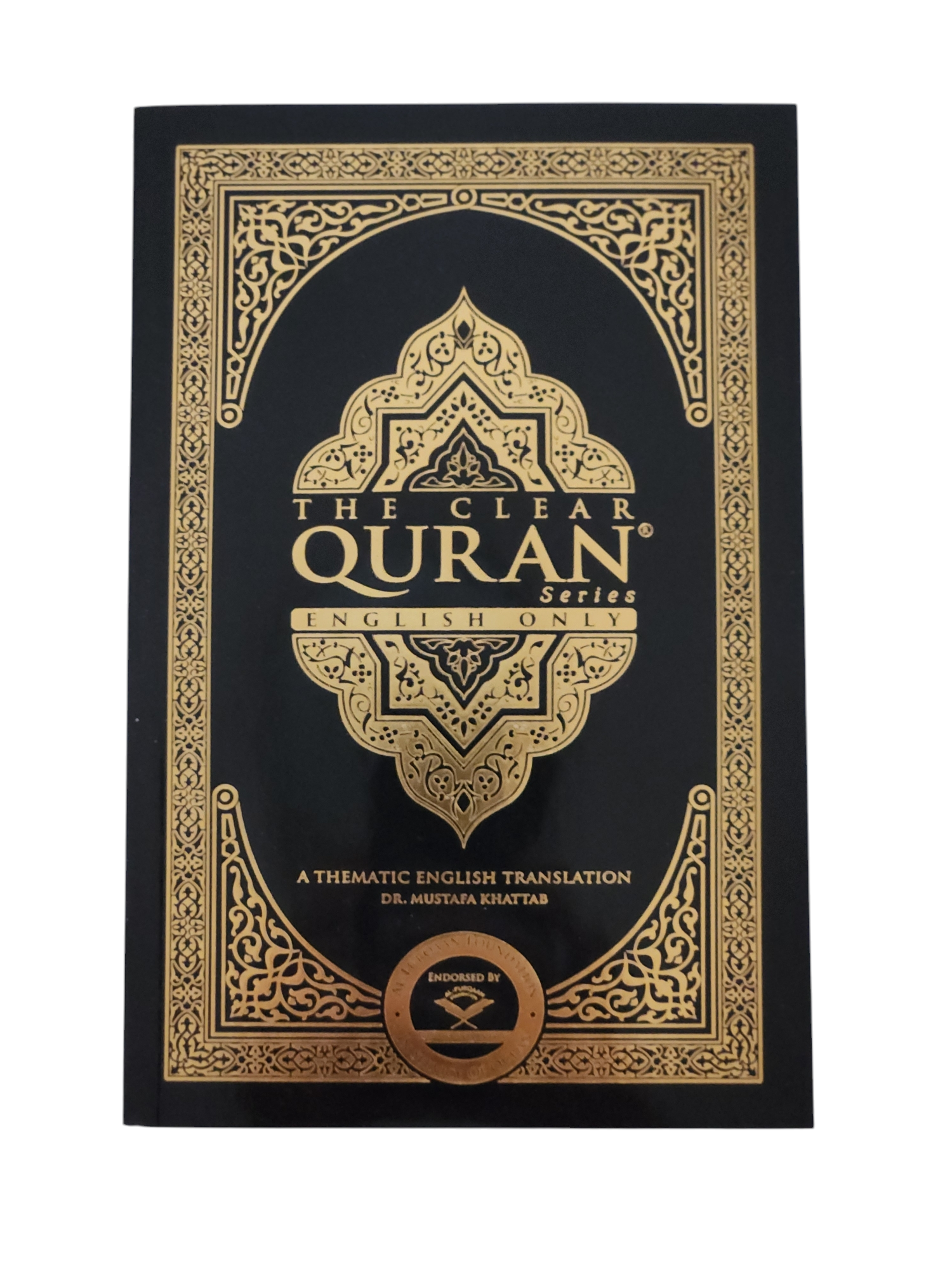 The image shows the cover of 'The Clear Quran' with decorative patterns and text in a language that appears to be English.